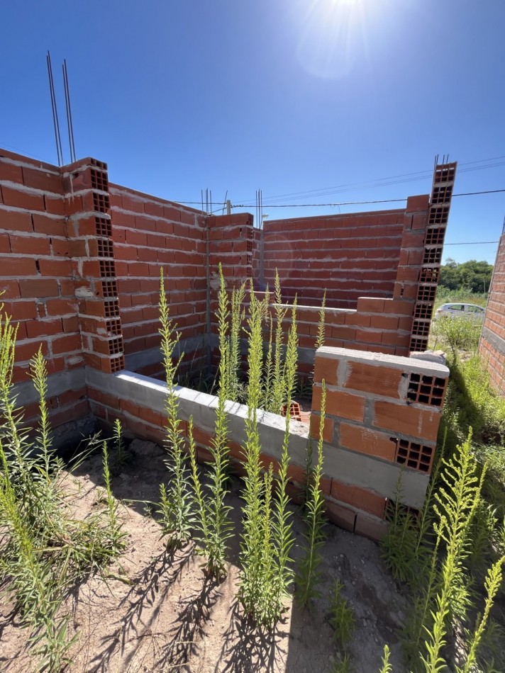 Terreno con construccion a terminar