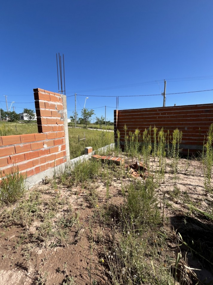 Terreno con construccion a terminar